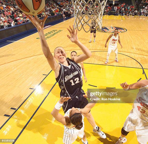 Ann Wauters of the San Antonio Silver Stars shoots over Tully Bevilaqua of the Indiana Fever at Conseco Fieldhouse on June 15, 2008 in Indianapolis,...