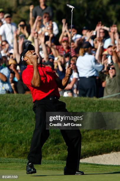 Tiger Woods reacts to his birdie putt on the 18th green to force a playoff with Rocco Mediate during the final round of the 108th U.S. Open at the...