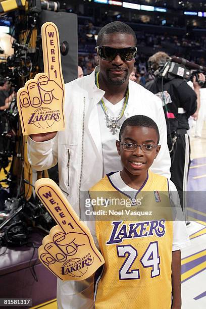 Actor Chris Tucker and his son, Destin Christopher, attend Game Five of the 2008 NBA Finals between the Boston Celtics and the Los Angeles Lakers on...
