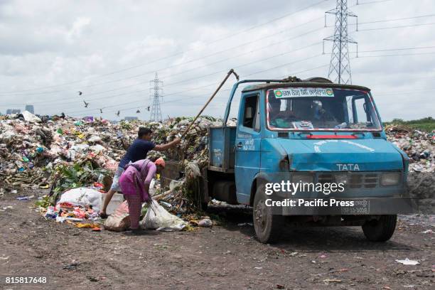 People sift through mountains of rubbish searching for anything reusable or recyclable they can sell - although it will earn them less than $3 a day....