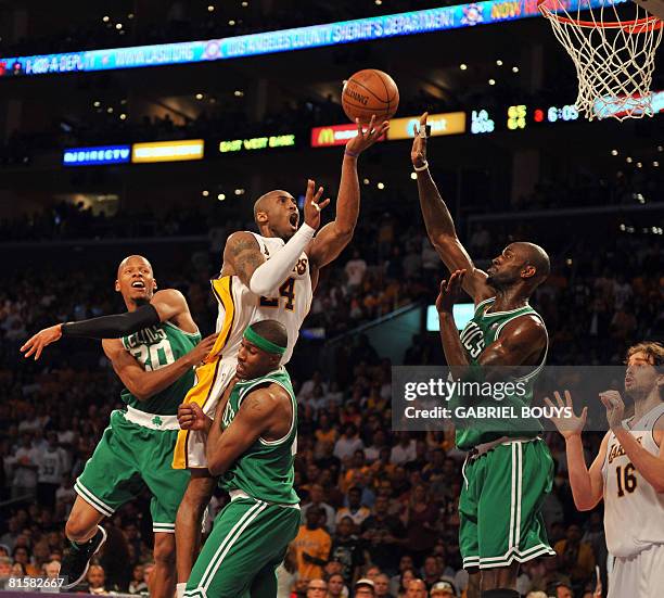 Los Angeles Lakers' Kobe Bryant scores in front of Boston Celtics' defenders during the Game 5 of the 2008 NBA Finals, in Los Angeles, California,...