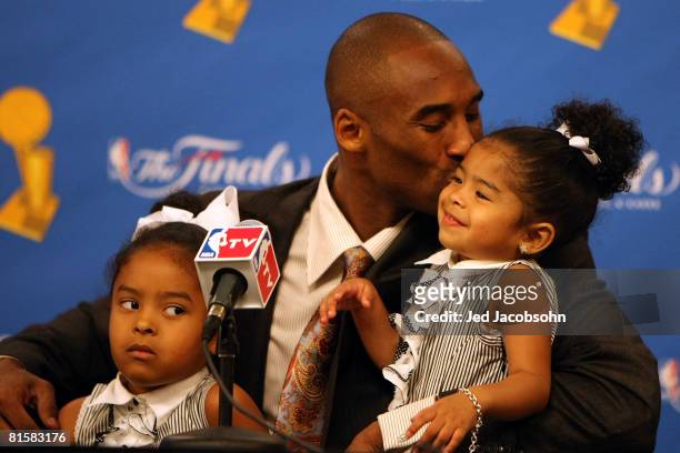 Kobe Bryant of the Los Angeles Lakers kisses daughter Gianna in a press conference after the Lakers' win over the Boston Celtics in Game Five of the...