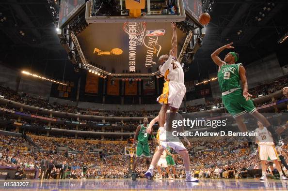 Kobe Rondo Point Rajon Rondo of the Boston Celtics puts up a shot over Kobe Bryant of ...