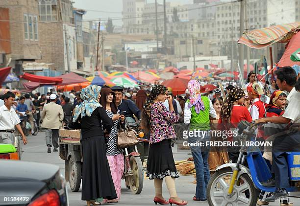 Uighur Muslims crowd the Sunday Bazaar in Kashgar on June 15, 2008 in northwest China's Xinjiang Uighur Autonomous Region. Once the sole outpost of...