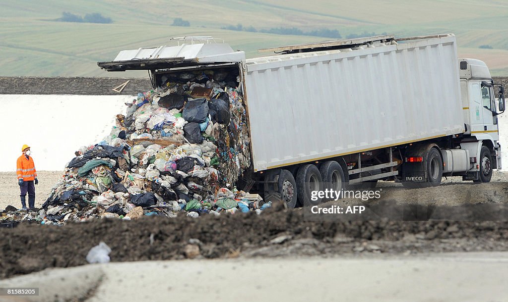 A truck moves rubbish from the Naples ar