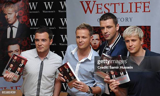 Shane Filan, Nicky Byrne, Mark Feehily and Kian Egan of Westlife pose at a signing session for their new book 'Westlife' at Waterstone's on June 16,...