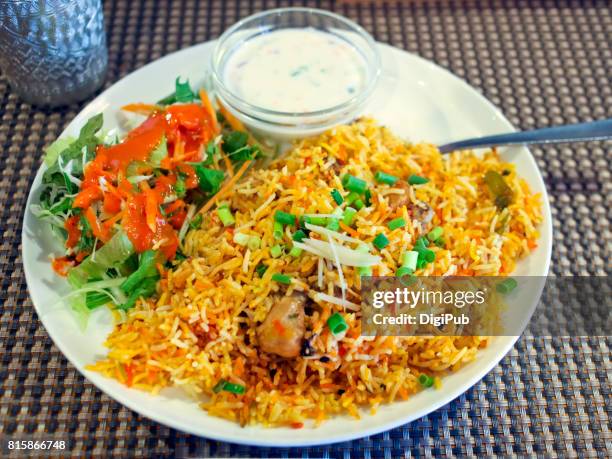 indian dish biryani served at an indian restaurant in tokyo - biriyani stockfoto's en -beelden