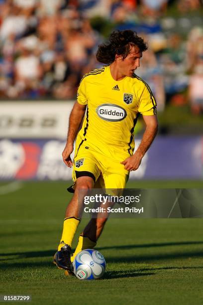 Guillermo Barros Schelotto of the Columbus Crew dribbles against the Kansas City Wizards during the game at Community America Ballpark on June 14,...