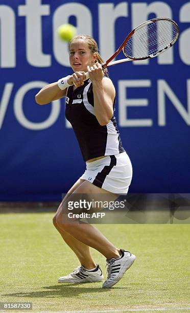 British tennis player Katie O'Brien in action against Australian tennis player Samantha Stosur during the first day of the International Women's...