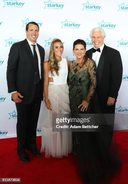 Chad Greenway, Jennifer Capista, Tani Austin, and Bill Austin pose on the red carpet at the 2017 Starkey Hearing Foundation So the World May Hear...