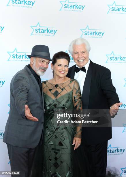 Danny Seraphine, Tani Austin, and Bill Austin pose on the red carpet at the 2017 Starkey Hearing Foundation So the World May Hear Awards Gala at the...