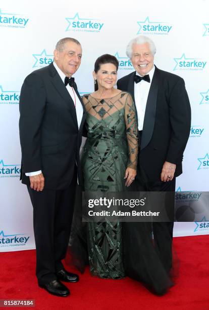 Leonard Wilf, Tani Austin, and Bill Austin pose on the red carpet at the 2017 Starkey Hearing Foundation So the World May Hear Awards Gala at the...