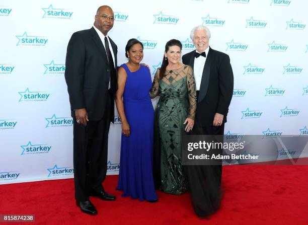 Chris Doleman, Toni Doleman, Tani Austin, and Bill Austin pose on the red carpet at the 2017 Starkey Hearing Foundation So the World May Hear Awards...