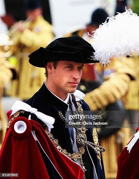 Prince William arrives next to his father Prince Charles, Prince of Wales as they walk to St. George's Chapel to partake in Garter Day, the 660th...