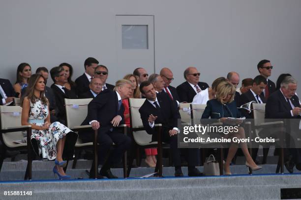 President Donald Trump and his wife Melania Trump, French President Emmanuel Macron and his wife Brigitte Trogneux congratul the traditional Bastille...