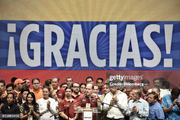 Julio Borges, president of Venezuela's National Assembly, center, speaks as lawmakers and opposition leaders look on after the result announcement of...