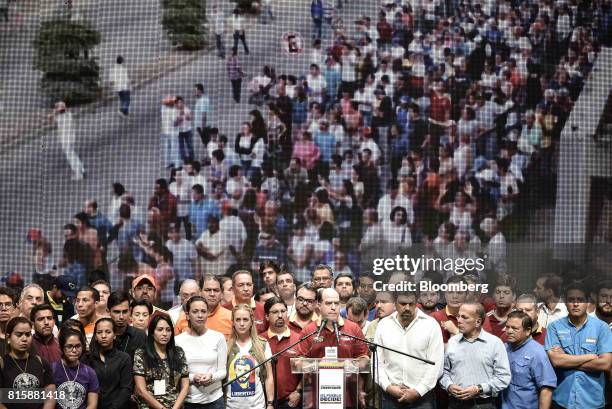 Julio Borges, president of Venezuela's National Assembly, center, speaks as lawmakers and opposition leaders look on after the result announcement of...