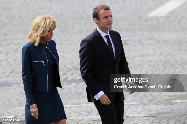 French President Emmanuel Macron and his wife Brigitte Trogneux during the traditional Bastille day military parade on the Champs-Elysees on July 14,...