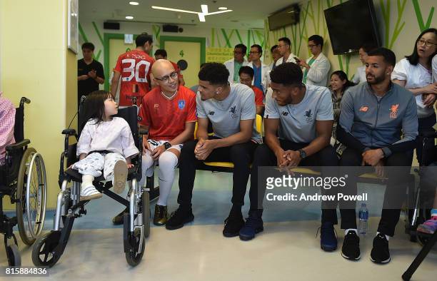 Dominic Solanke, Joe Gomez and Kevin Stewart of Liverpool visit The Duchess of Kent Children's Hospital Hong Kong during the Pre-Season tour on July...