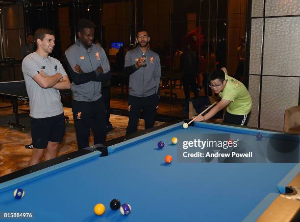 Jon Flanagan, Divock Origi and Kevin Stewart of Liverpool gets a visit from Camp Quality Hong Kong Charity at the Ritz Carlton hotel during the...