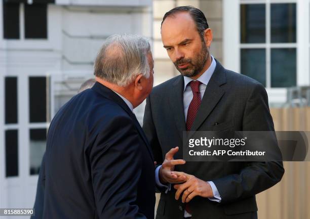French Prime Minister Edouard Philippe speaks with French Senate President Gerard Larcher before the opening of the 'Conference nationale des...