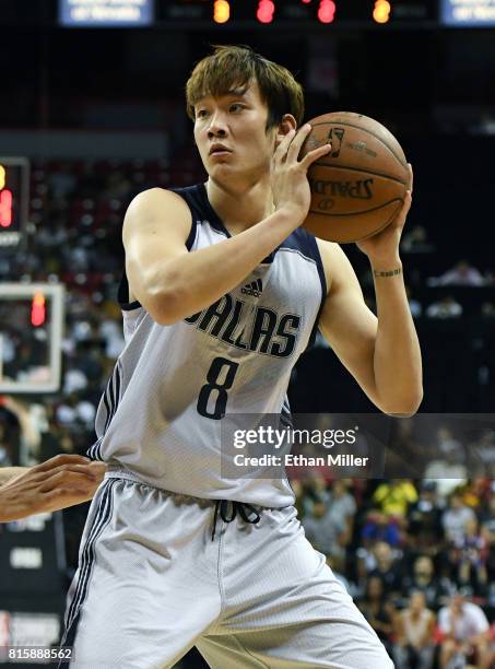 Ding Yanyuhang of the Dallas Mavericks holds the ball during a semifinal game of the 2017 Summer League against the Los Angeles Lakers at the Thomas...