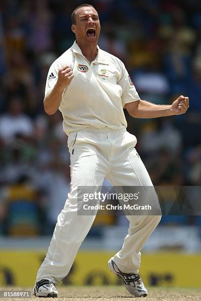 Stuart Clarke of Australia celebrates taking the wicket of Shivnarine Chanderpaul of the West Indies during day five of the third test match between...