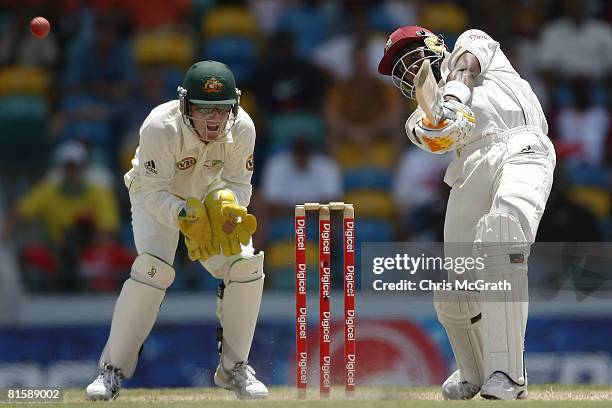 Dwayne Bravo of the West Indies hits a six off the bowling of Beau Casson of Australia during day five of the third test match between the West...