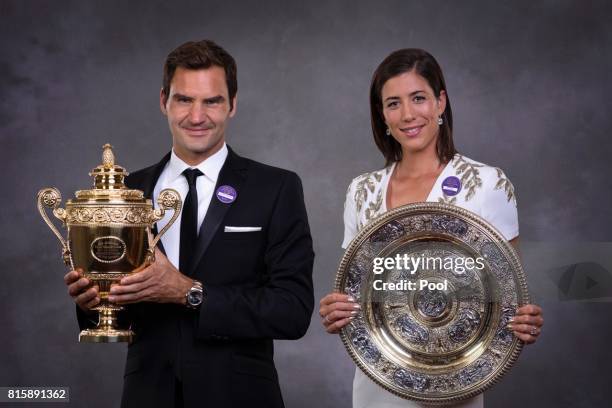 Roger Federer and Garbine Muguruza pose with their trophies at the Wimbledon Winners Dinner at The Guildhall on July 16, 2017 in London, England.