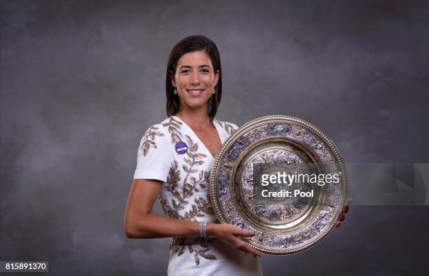 Garbine Muguruza poses with the trophy at the Wimbledon Winners Dinner at The Guildhall on July 16, 2017 in London, England.
