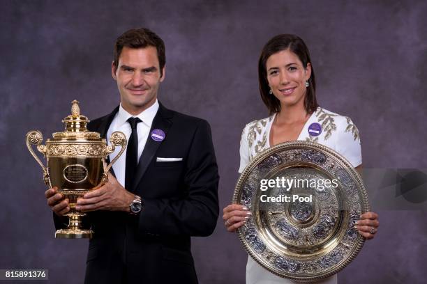 Roger Federer and Garbine Muguruza pose with their trophies at the Wimbledon Winners Dinner at The Guildhall on July 16, 2017 in London, England.