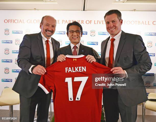 Peter Moore CEO of Liverpool and Billy Hogan Cheif Comercial Officer of Liverpool give a shirt to Saturo Yamatomo Director and Senior Executive of...