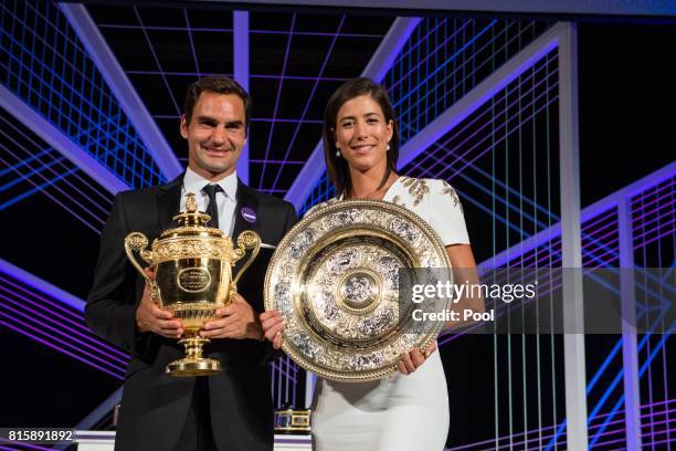 Roger Federer and Garbine Muguruza pose with their trophies at the Wimbledon Winners Dinner at The Guildhall on July 16, 2017 in London, England.