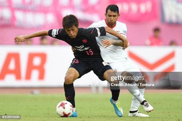 Yasuki Kimoto of Cerezo Osaka and Walter Montoya Sevilla FC compete for the ball during the preseason friendly match between Cerezo Osaka and Sevilla...