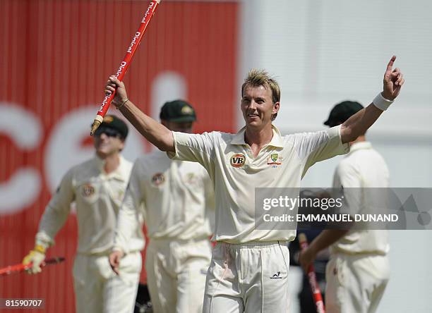 Australian bowler Brett Lee raises a stump in celebration of Australia's victory over the West Indies, at the end of the fifth and last day of the...