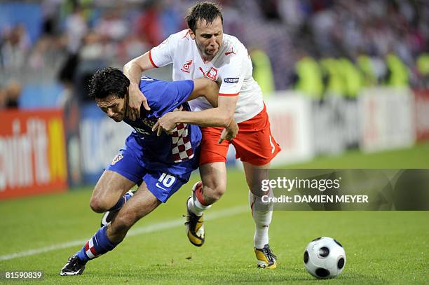 Croatian midfielder Jerko Leko vies with Polish midfielder Dariusz Dudka during the final Euro 2008 Championships Group B football match Poland vs....