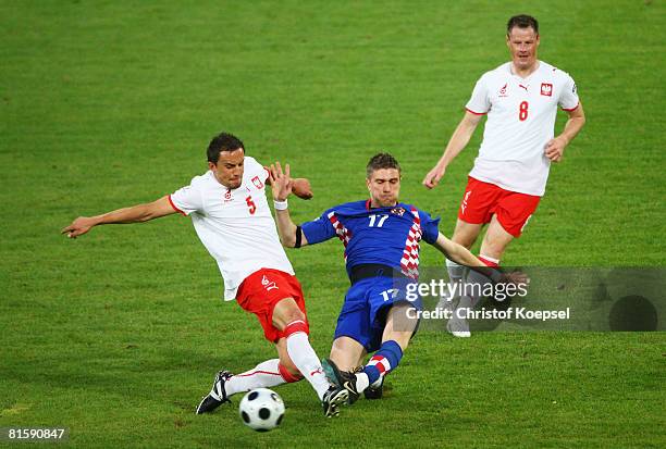 Croatia's Ivan Klasnic is surrounded by Poland's Dariusz Dudka and Jacek Krzynowek during the UEFA EURO 2008 Group B match between Poland and Croatia...