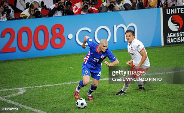 Croatian forward Mladen Petric vies with Polish midfielder Dariusz Dudka during the Euro 2008 Championships Group B football match Poland vs. Croatia...