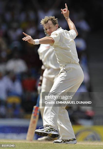 Australian bowler Brett Lee celebrates after taking the wicket of West Indies' batsman Sewnarine Chattergoon , during the fifth and last day of the...