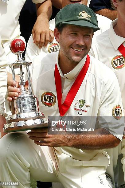 Australian captain Ricky Ponting poses with the Worrell Trophy after defeating the West Indies during day five of the third test match between the...