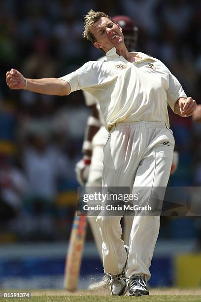 Brett Lee of Australia celebrates taking the wicket of Sewnarine Chattergoon of the West Indies during day five of the third test match between the...
