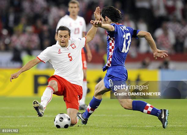 Polish midfielder Dariusz Dudka vies with Croatian midfielder Nikola Pokrivac during the final Euro 2008 Championships Group B football match Poland...