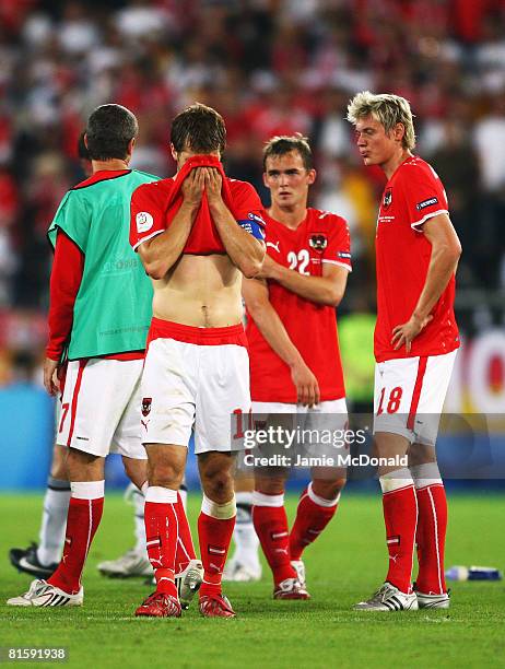 Andreas Ivanschitz , Erwin Hoffer and Roman Kienast of Austria look dejected after defeat in the UEFA EURO 2008 Group B match between Austria and...