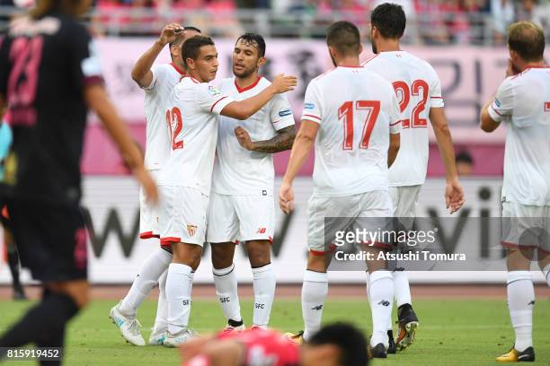 Wissam Ben Yedder of Sevilla FC celebrates with his team mates after scoring a goal during the preseason friendly match between Cerezo Osaka and...
