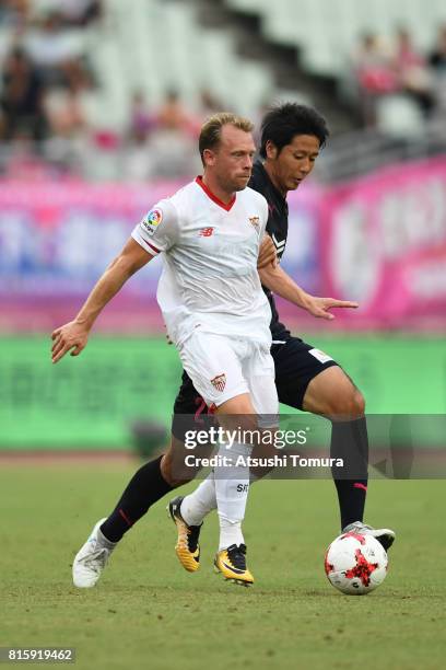 Michael Krohn-Dehli of Sevilla FC runs with the ball during the preseason friendly match between Cerezo Osaka and Sevilla FC at Yanmar Stadium Nagai...
