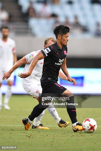 Hotaru Yamaguchi of Cerezo Osaka runs with the ball during the preseason friendly match between Cerezo Osaka and Sevilla FC at Yanmar Stadium Nagai...