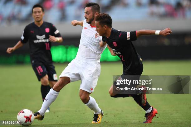 Pablo Sarabia of Sevilla FC and Riku Matsuda of Cerezo Osaka compete for the ball during the preseason friendly match between Cerezo Osaka and...