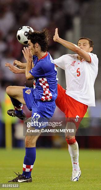Croatian midfielder Nikola Pokrivac vies with Polish midfielder Dariusz Dudka during the final Euro 2008 Championships Group B football match Poland...