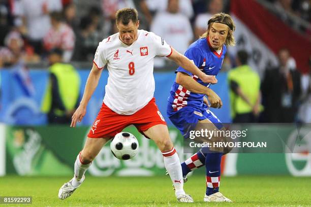 Polish midfielder Jacek Krzynowek vies with Croatian defender Dario Simic during the Euro 2008 Championships Group B football match Poland vs....