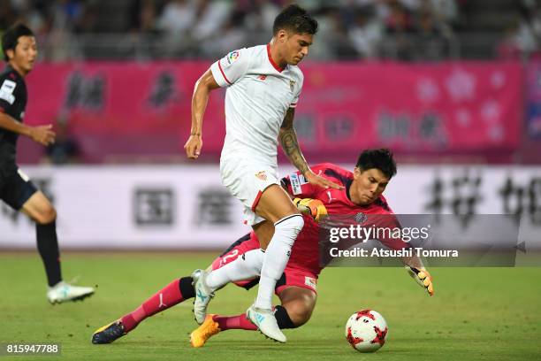 Joaquin Correa of Sevilla FC and Kim Jinhyeon of Cerezo Osaka in action during the preseason friendly match between Cerezo Osaka and Sevilla FC at...